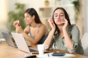 Two Teleworkers Wasting Time Bored At Home