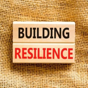 Building Resilience Symbol. Concept Word Building Resilience Typed On Wooden Blocks. Beautiful Canvas Table Canvas Background. Business And Building Resilience Concept. Copy Space.