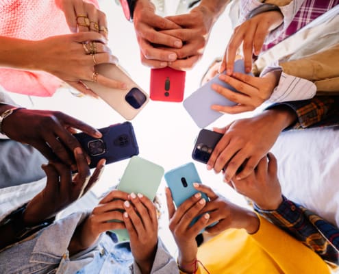 Young Group Of Student People Using Smartphone Together Outside
