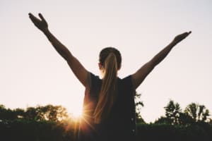 Cheering Woman At Mountain Peak